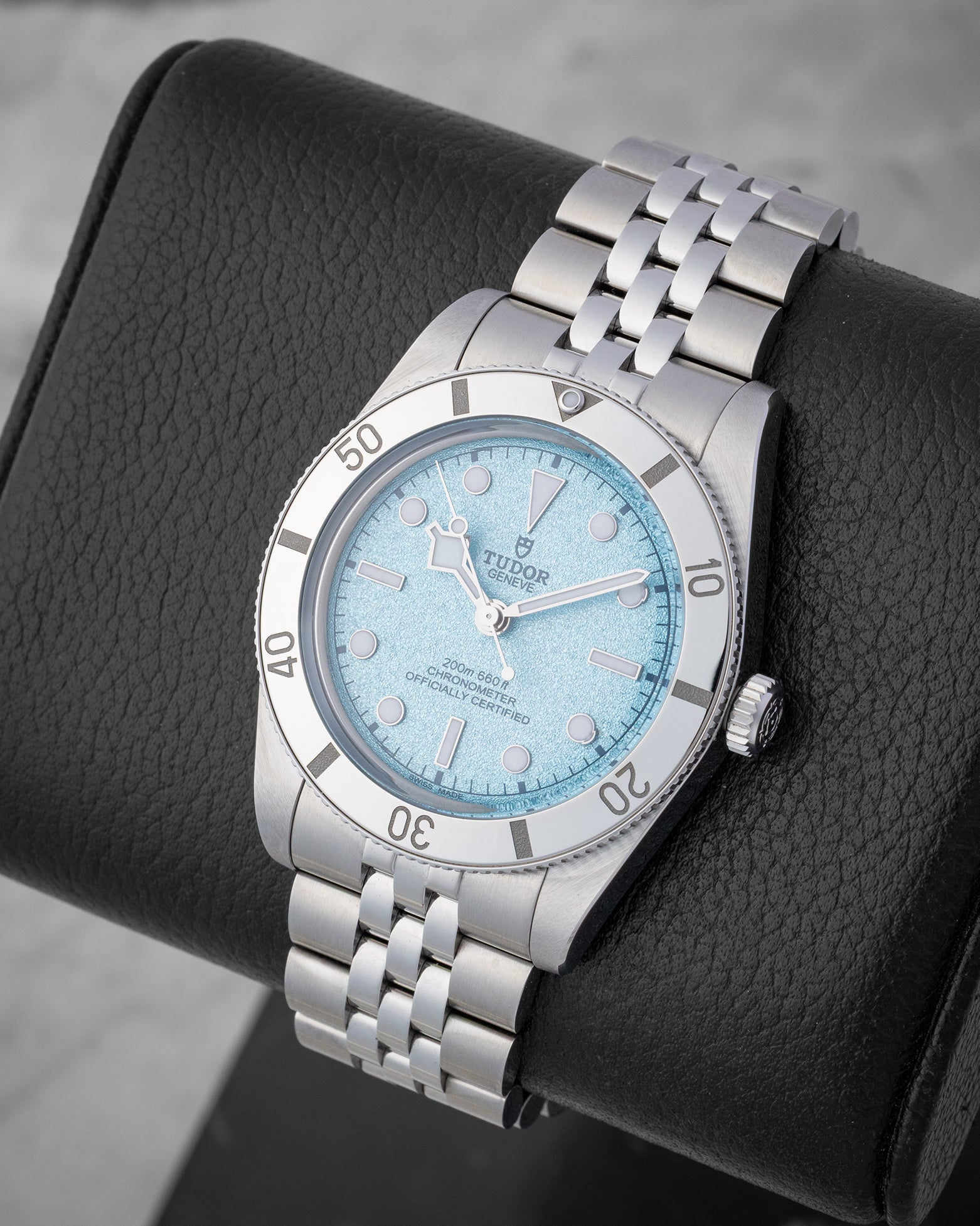 angled profile view of a 2025 Tudor Black Bay 54 reference M79000-0001 showcasing the textured light blue dial and five-link stainless steel bracelet