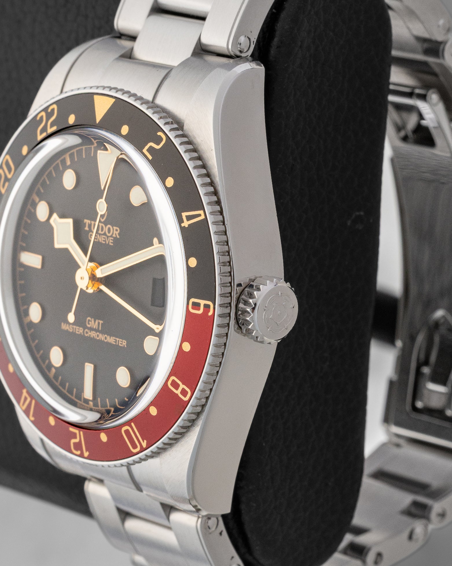 Close-up right profile view of the steel Tudor Black Bay 58 GMT case highlighting the coin-edge bezel and screw-down crown