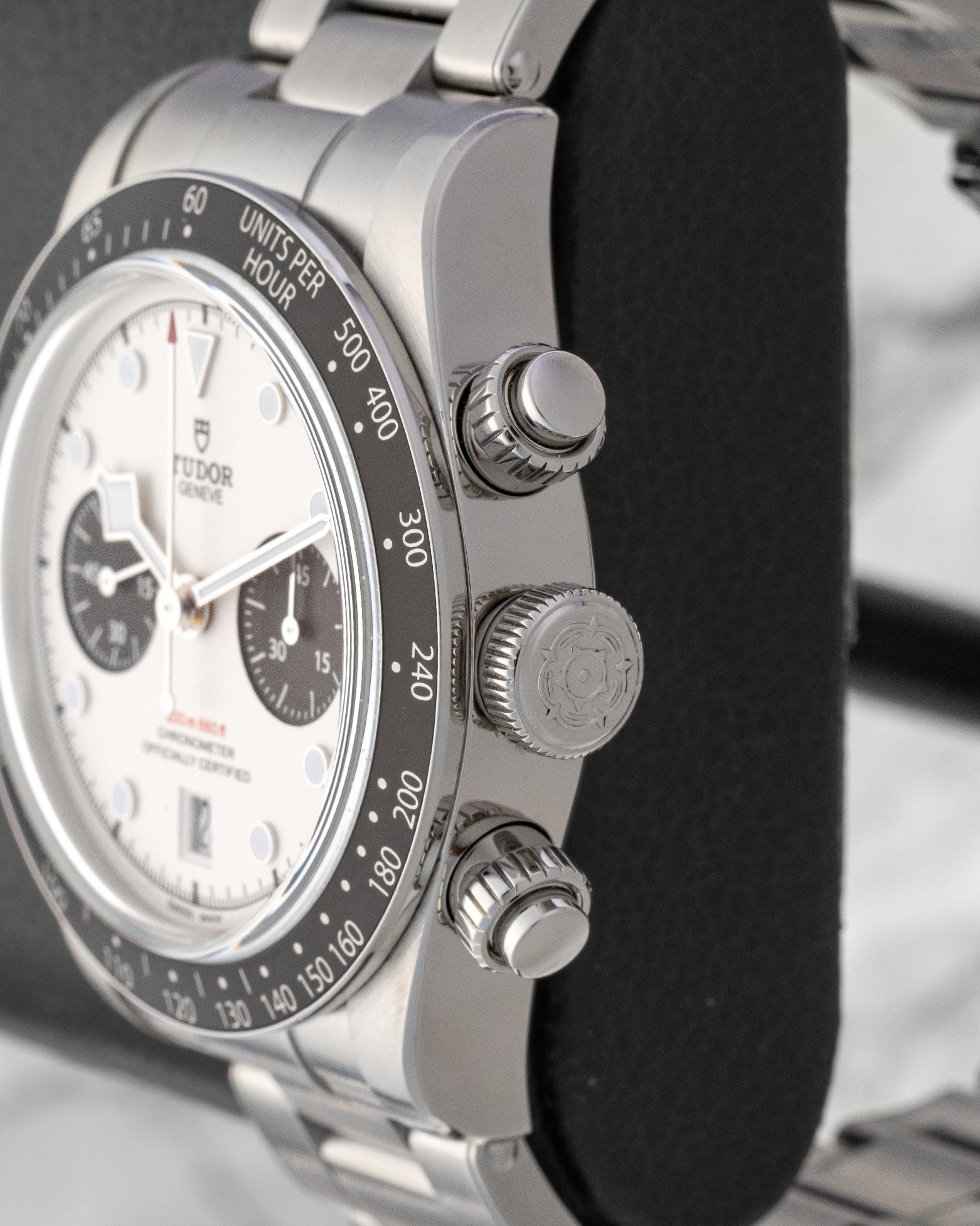 Close-up right profile view of the steel Tudor Black Bay Chrono case highlighting the screw-down crown and knurled chronograph pushers