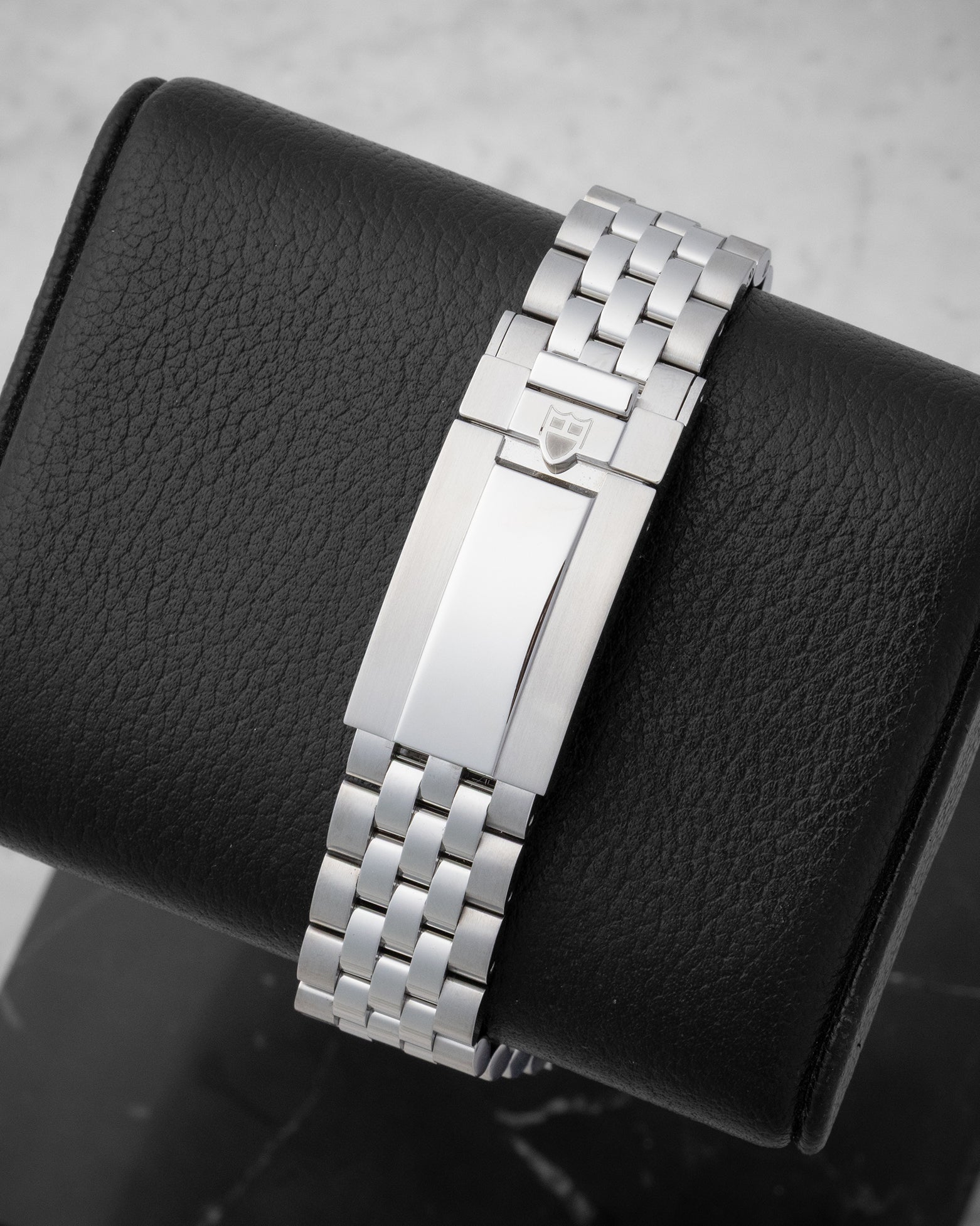 Rear studio view of the stainless steel five-link watch bracelet and secure folding safety clasp with T-fit micro-adjustment system