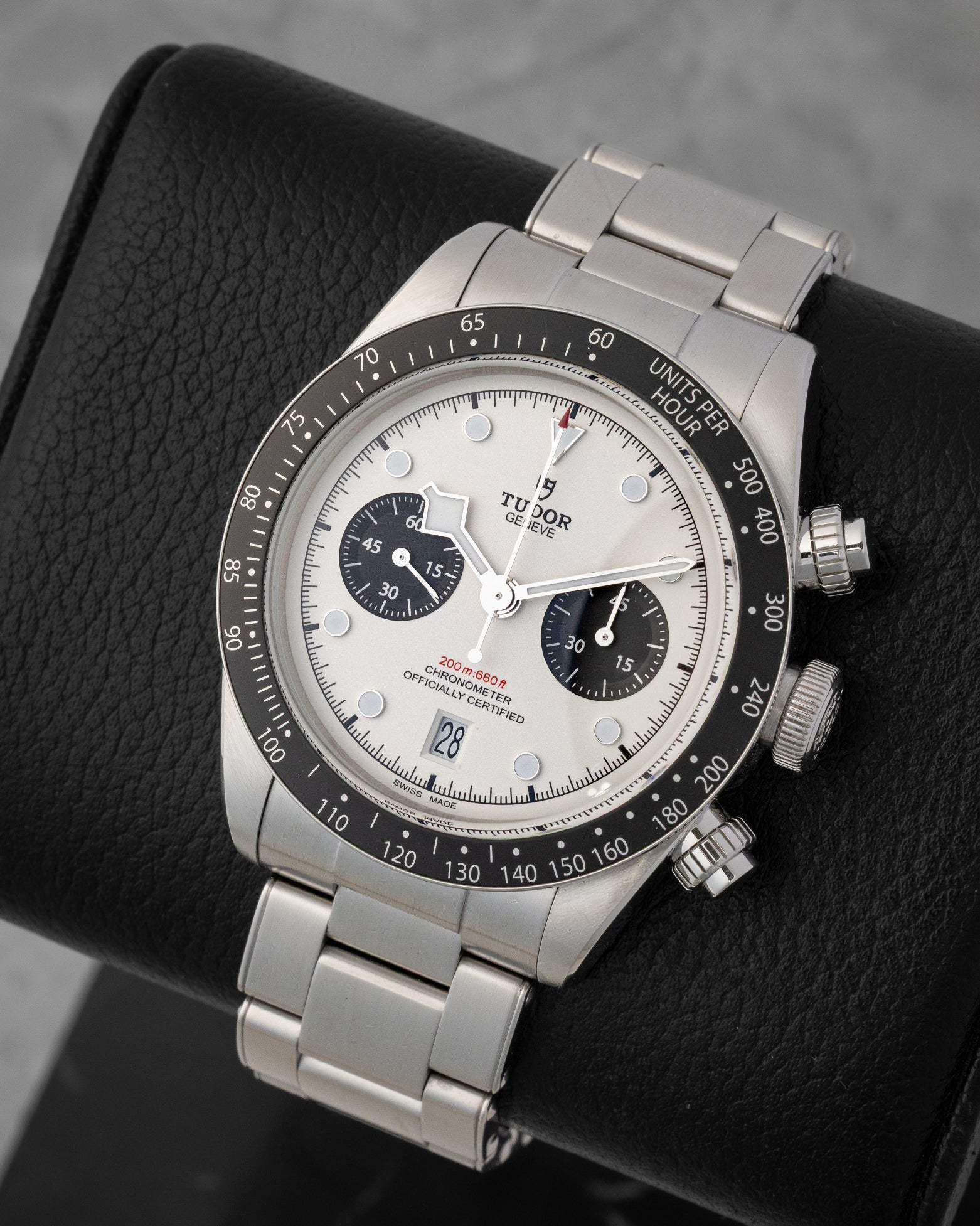 angled top-down studio overview of the 41mm stainless steel Tudor Black Bay Chrono watch showing its dual black sub-dials and steel bracelet