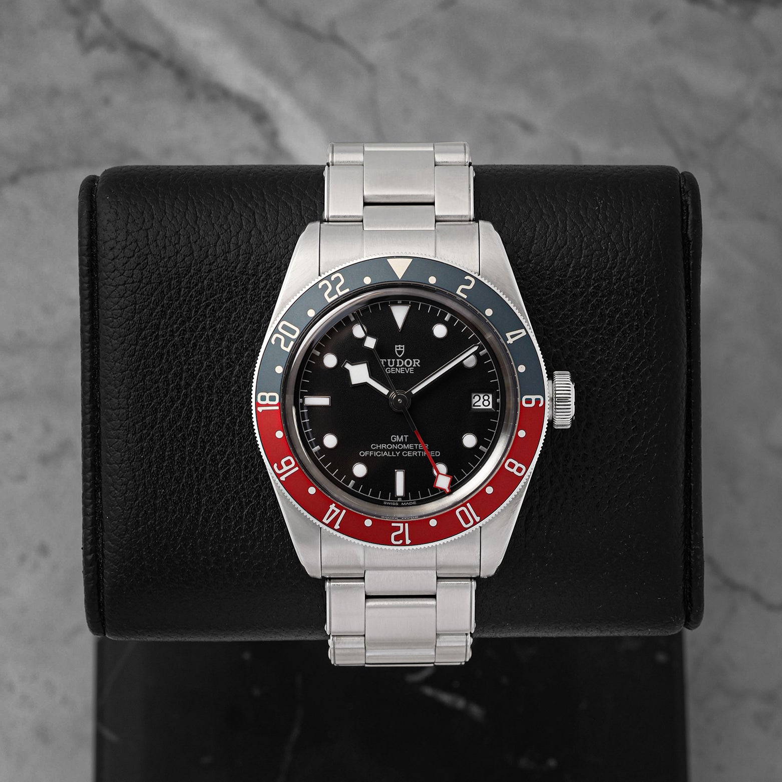 A 2021 Tudor Black Bay GMT reference 79830RB displaying its signature matte black dial, burgundy and blue Pepsi bezel, and iconic luminous snowflake hands at Noah's Fine Watches & Jewelry in Dallas