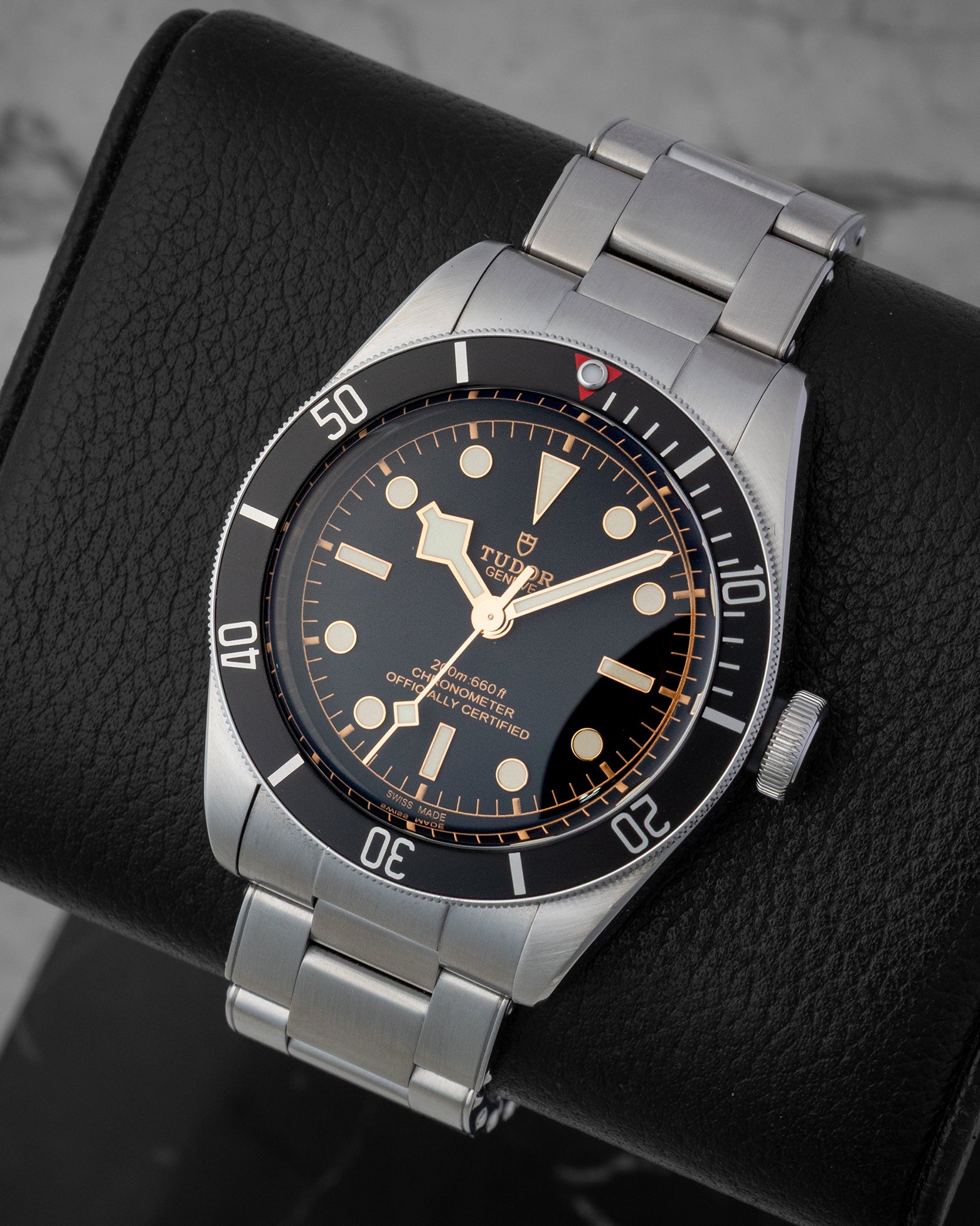 Angled front view of a stainless steel Tudor Black Bay M79230N automatic watch at Noah's Fine Watches in Dallas