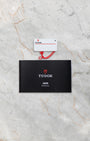 Tudor Black Bay M79230N official warranty card, user manual, and hang tag at Noah's Fine Watches & Jewelry