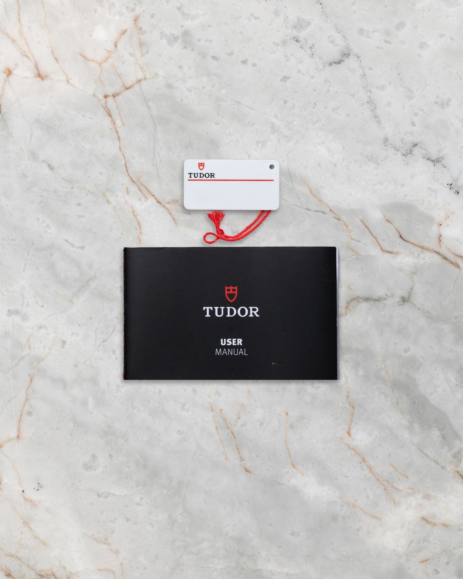 Tudor Black Bay M79230N official warranty card, user manual, and hang tag at Noah's Fine Watches & Jewelry