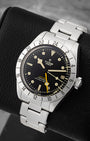 Angled view of pre-owned Tudor Black Bay Pro 79470 featuring a matte black domed dial, luminous hour markers, and fixed 24-hour graduated steel bezel