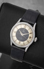 angled top-down overview of the 34mm vintage stainless steel Tudor Oyster Prince reference 7950 showing its cross-hair Tuxedo dial configuration