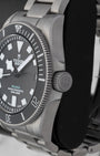 Right side profile showcasing the titanium screw-down crown and matte black ceramic unidirectional rotating bezel on a Tudor Pelagos Ultra