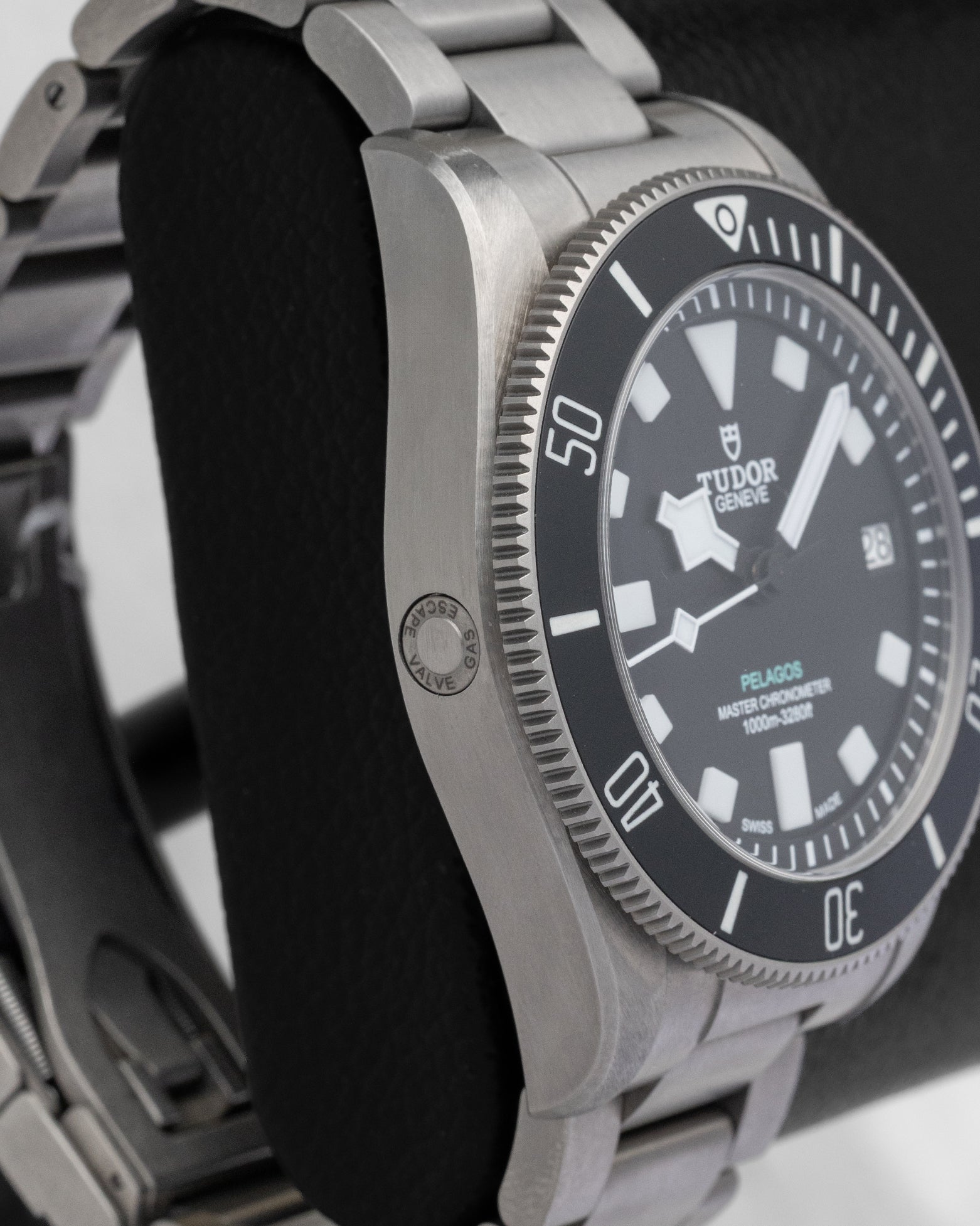 Left side view highlighting the satin-finished titanium case and compact helium escape valve on the 43mm Tudor Pelagos Ultra