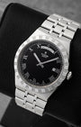 Angled view of pre-owned Tudor Royal Day-Date M28600 featuring a black dial, applied silver Roman numerals, day window at 12 o'clock, and date at 3 o'clock