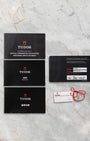 Original Tudor international guarantee card, user manual booklets, and serial hangtag included with pre-owned Tudor Royal M28600 set