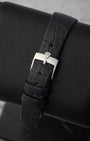 rear snapshot focusing on the black scaled alligator leather strap and the vintage-style polished stainless steel pin buckle