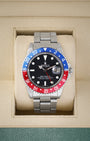 Vintage 1966 Rolex GMT-Master 1675 stainless steel watch with aged red and blue Pepsi bezel and matte black dial at Noah's Fine Watches and Jewelry Dallas Texas
