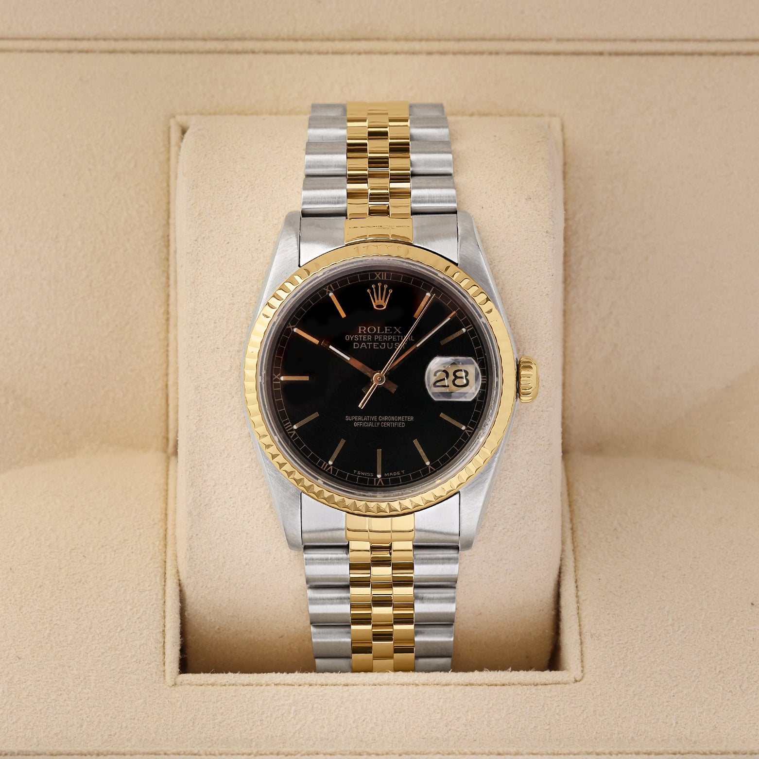 A vintage 1988 Rolex Datejust 36 reference 16233 in two-tone stainless steel and 18k yellow gold featuring a glossy black dial and Jubilee bracelet inside its box at Noah's Fine Watches & Jewelry in Dallas