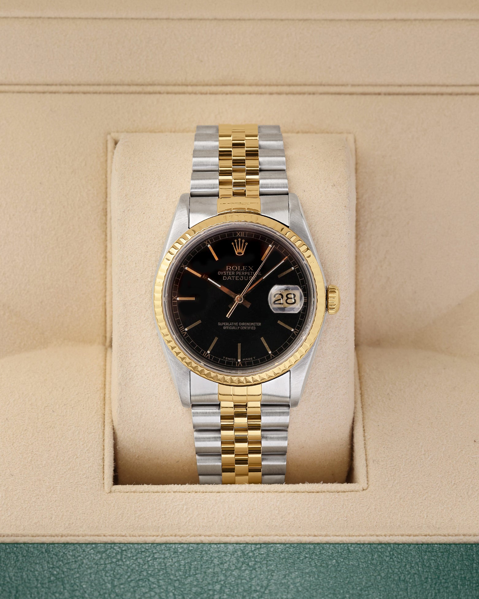 A vintage 1988 Rolex Datejust 36 reference 16233 in two-tone stainless steel and 18k yellow gold featuring a glossy black dial and Jubilee bracelet inside its box at Noah's Fine Watches & Jewelry in Dallas
