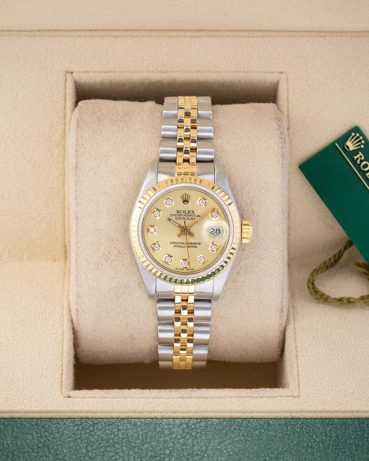 Vintage 1990 Rolex Lady-Datejust 26mm 69173 two-tone steel and yellow gold watch with champagne diamond dial at Noah's Fine Watches and Jewelry Dallas Texas