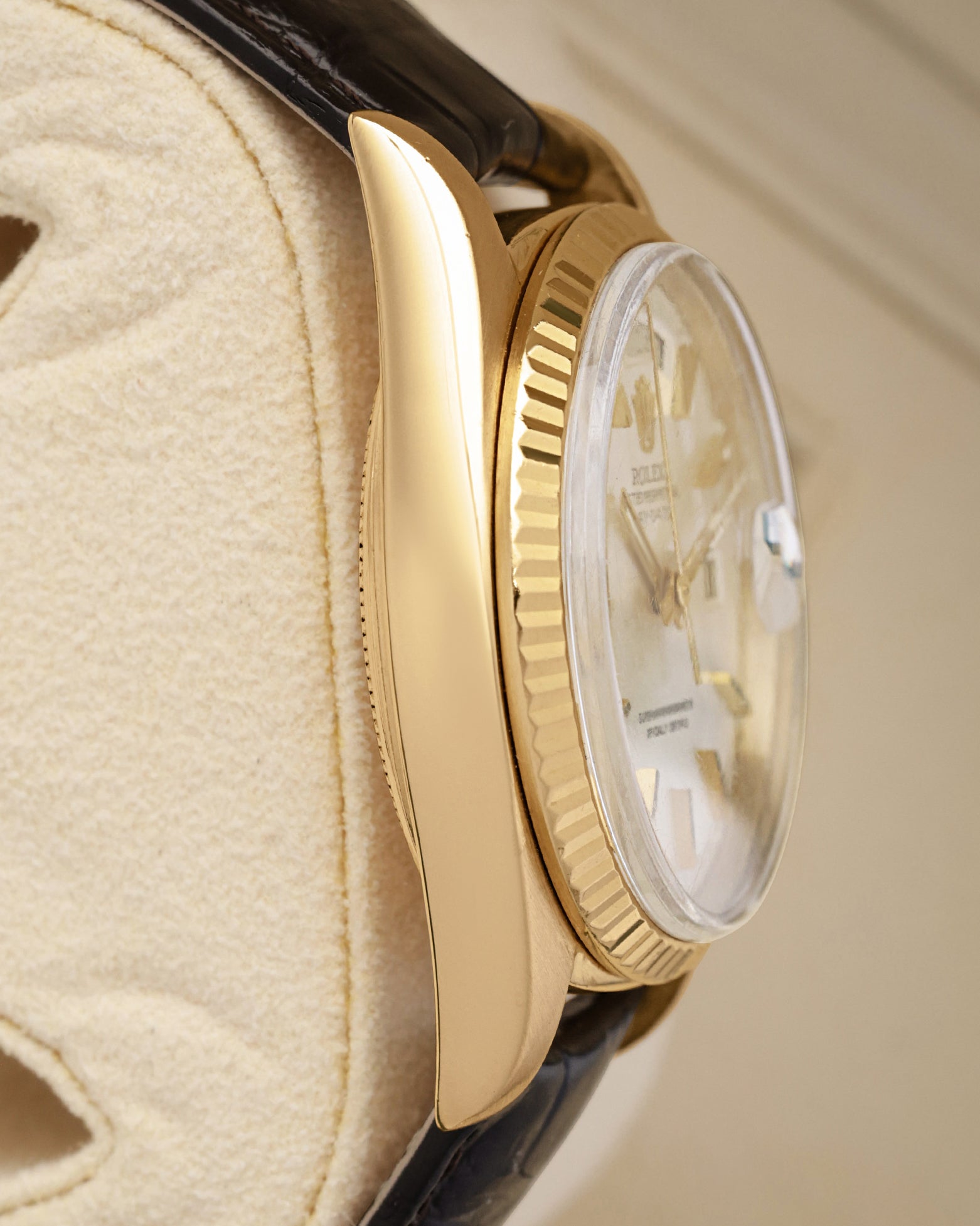 Left side perspective of the classic 36mm Oyster case profile and polished gold finish of the 1973 Rolex Day-Date President