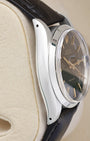 Side profile view of the polished stainless steel case on the non-crown side of a vintage 34mm Rolex Oysterdate Precision