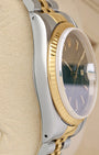 Left-side macro profile view showcasing the mirror-polished steel case band flank and the classic tapering silhouette of the integrated professional lugs