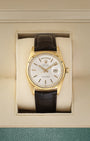 Front view of a vintage 1973 Rolex Day-Date Ref 1803 in 18k yellow gold, featuring a classic silver pie-pan dial and fluted bezel, available at Noah's Fine Watches and Jewelry Dallas