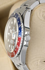 Stainless steel case profile view showcasing the small crown guards and original winding crown on a vintage 1966 Rolex GMT-Master 1675