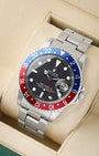 angled profile view of a vintage 1966 Rolex GMT-Master reference 1675 showcasing its iconic Pepsi aluminum insert bezel and steel Oyster bracelet