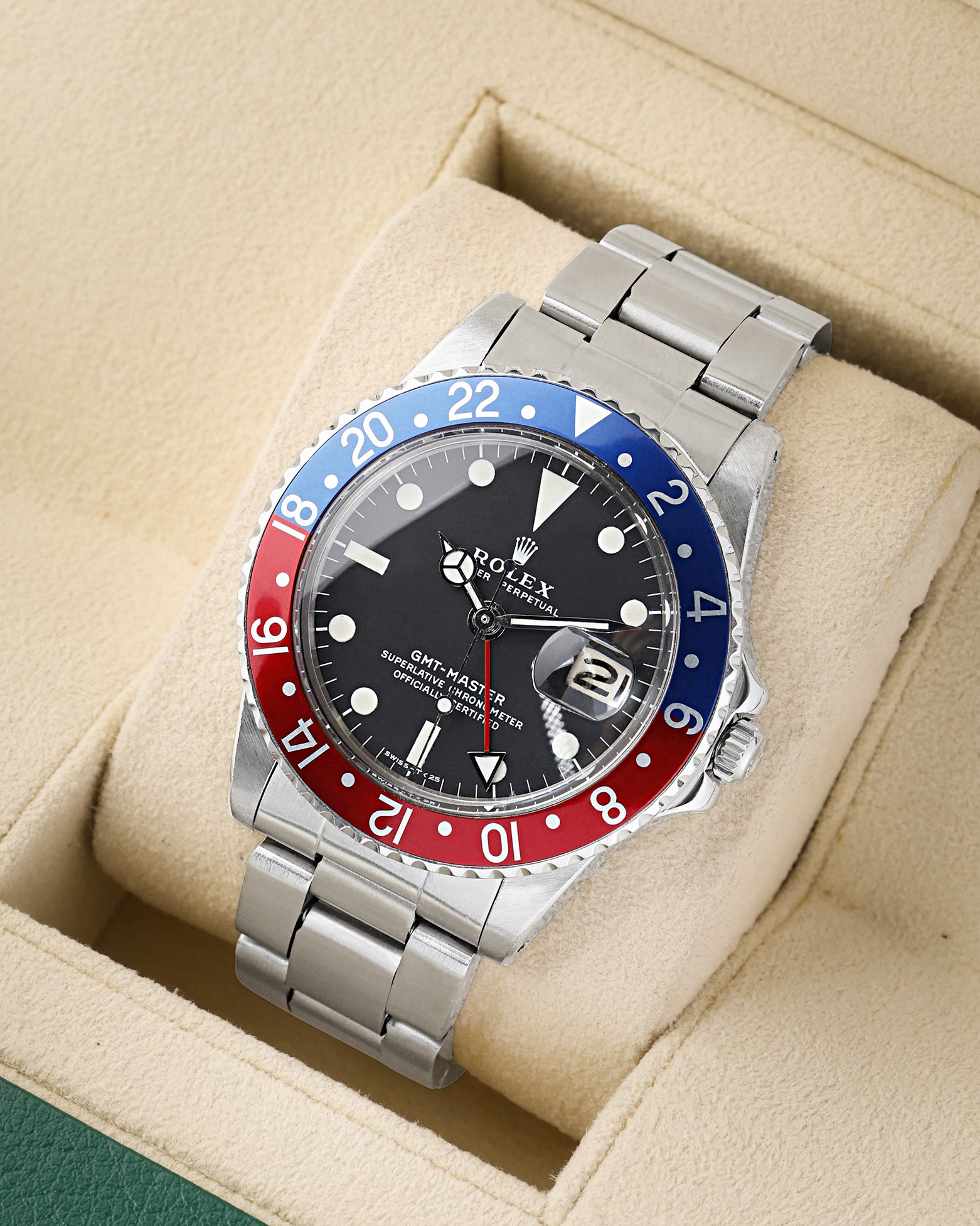 angled profile view of a vintage 1966 Rolex GMT-Master reference 1675 showcasing its iconic Pepsi aluminum insert bezel and steel Oyster bracelet