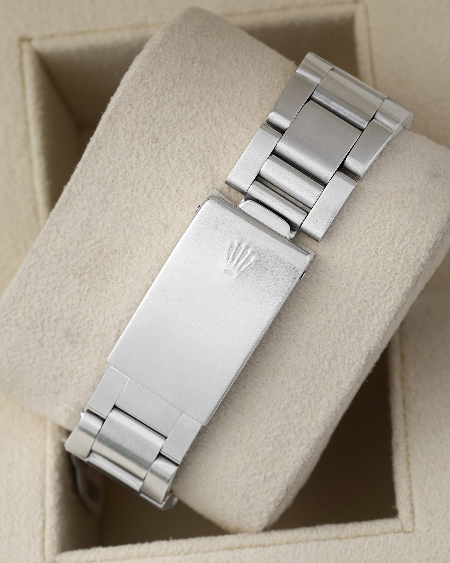 Rear view of the vintage stainless steel Oyster bracelet showing the traditional stamped folding box deployment clasp engraved with the period-correct Rolex crown coronet logo
