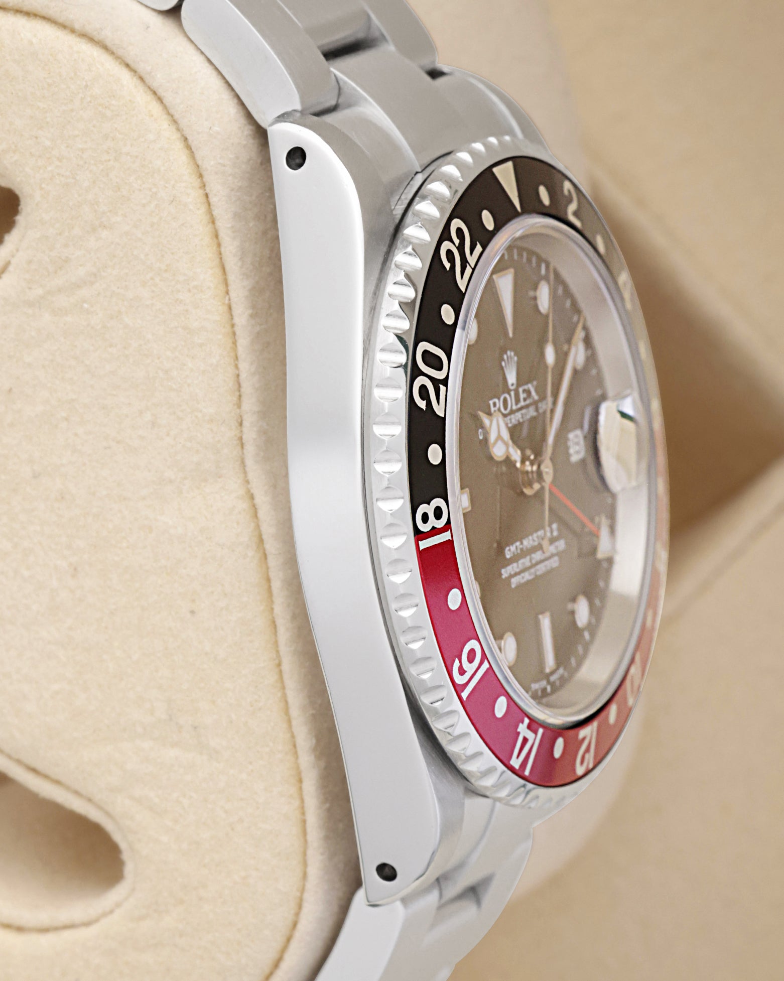 Side profile view of the polished and brushed stainless steel case on the non-crown side of a neo-vintage Rolex GMT-Master II 16710