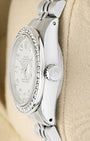 Polished stainless steel case profile view showcasing the screw-down winding crown on a vintage 26mm Rolex Lady-Datejust