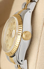 Close-up right profile view of the small ladies' watch head highlighting the high-dome vintage acrylic Plexiglass crystal, magnified Cyclops date window, and yellow gold crown