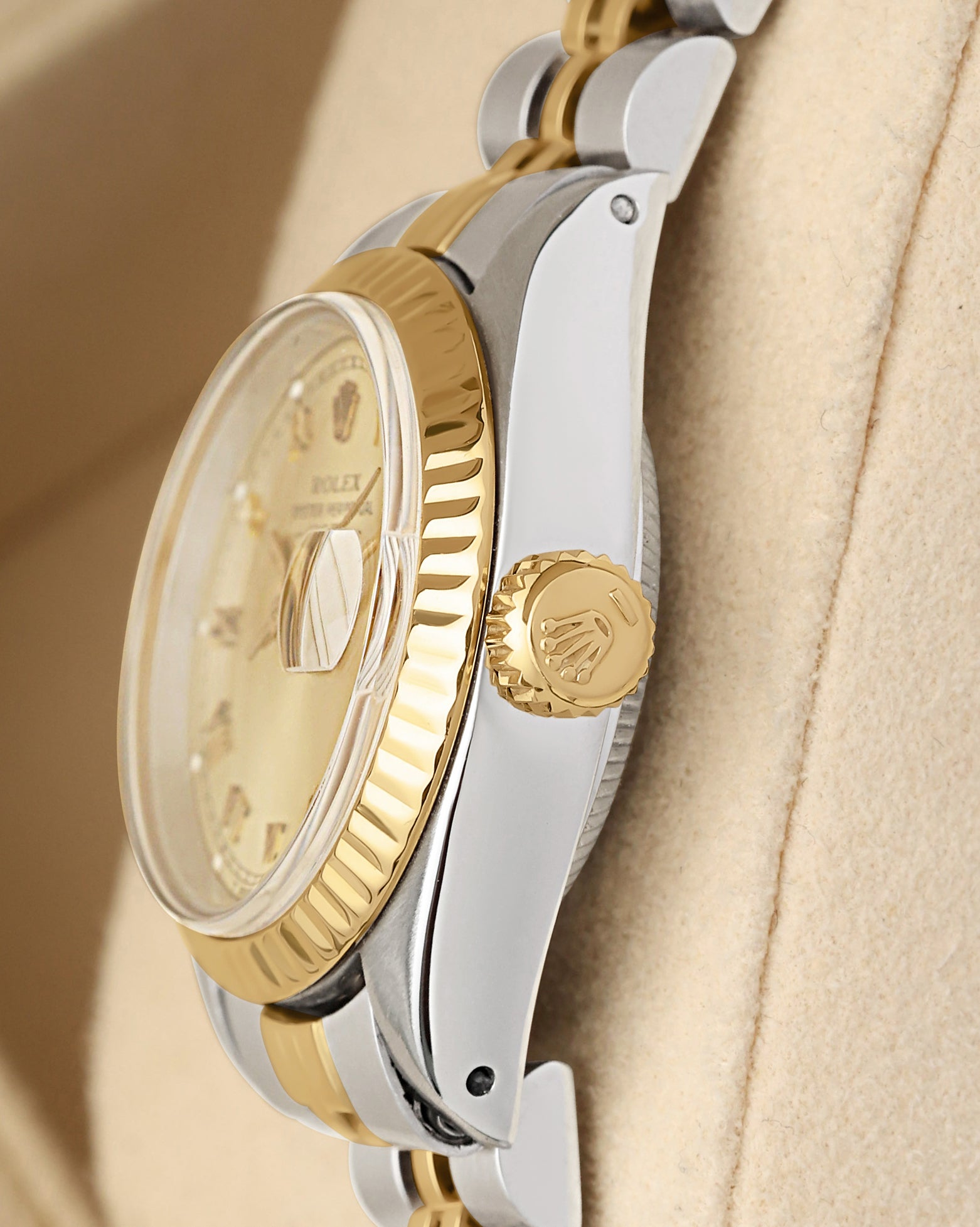 Close-up right profile view of the small ladies' watch head highlighting the high-dome vintage acrylic Plexiglass crystal, magnified Cyclops date window, and yellow gold crown