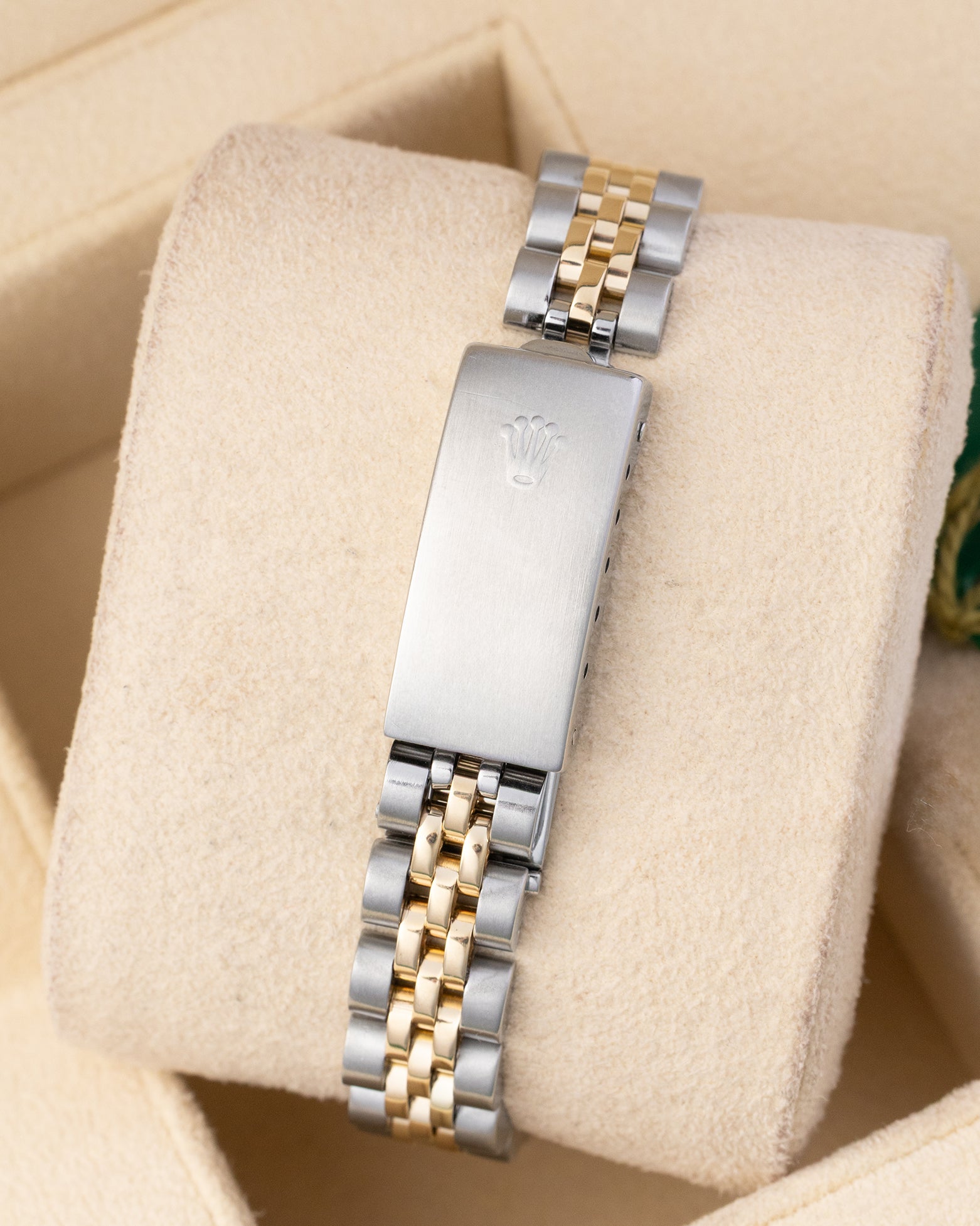 Rear view of the vintage two-tone steel and yellow gold Jubilee bracelet showing the stainless steel folding deployment clasp stamped with the Rolex crown coronet logo