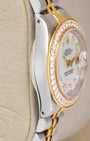 Side profile view of the polished stainless steel Oyster case on the non-crown side of a two-tone 1989 Rolex Datejust 26mm